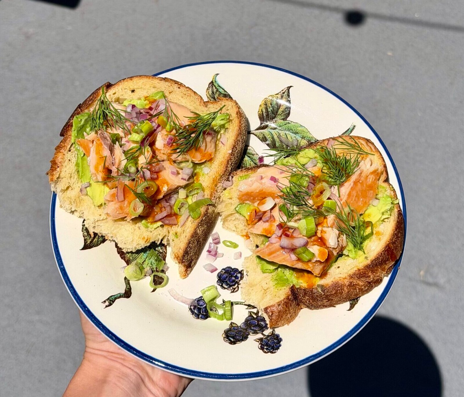 Avocado Toast with Smoked Salmon, Red Onion, Dill, and Smoked Pineapple Hot Sauce